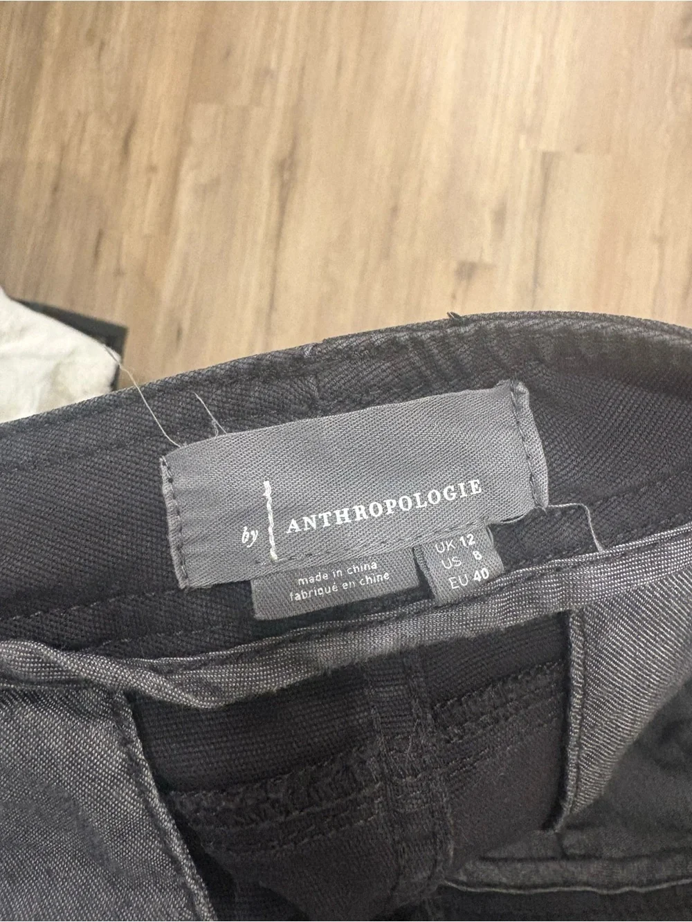 Anthropologie Black Tapered Pants with Pink Geometric Side Tape